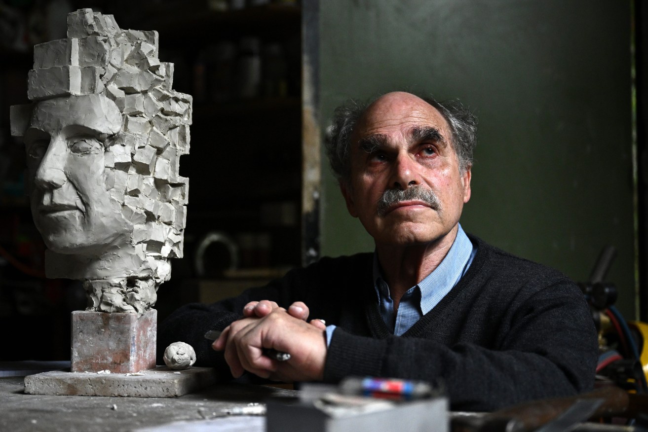 Sculptor Michael Meszaros poses for a photograph at his studio in Melbourne, Thursday, April 27, 2023. Thousands of Australian artists have been spared changes that could have left them uninsured and out of work after their provider performed a policy backflip. (AAP Image/Joel Carrett) NO ARCHIVING