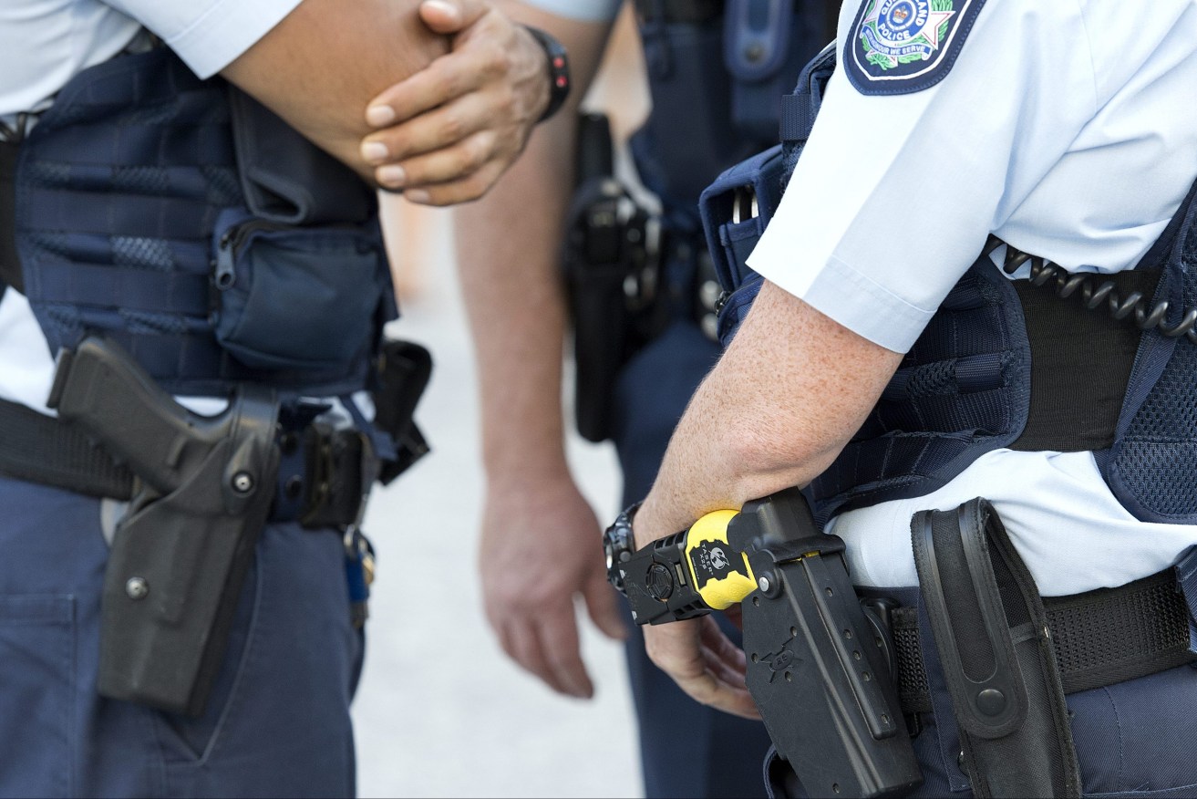 A female police officer was assaulted after waking two armed men sleeping in a car at Parkwood, Gold Coast. (AAP Image/Dave Hunt) 
