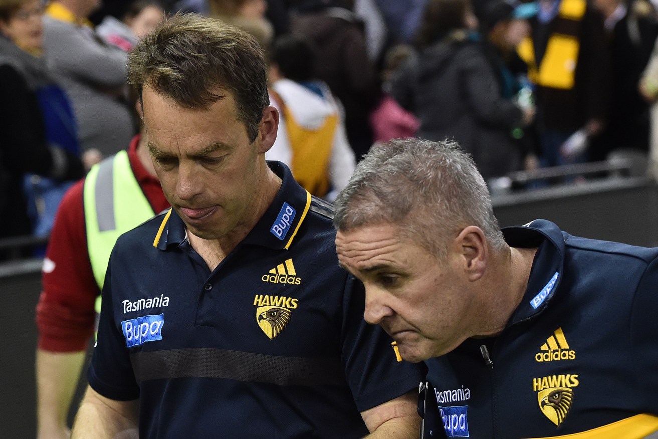 Hawthorn Hawks coach Alastair Clarkson (left) and former assistant, not Lions coach Chris Fagan are seen after the game against the Port Adelaide Power in round 21 of the AFL, 2015. (AAP Image/Julian Smith)