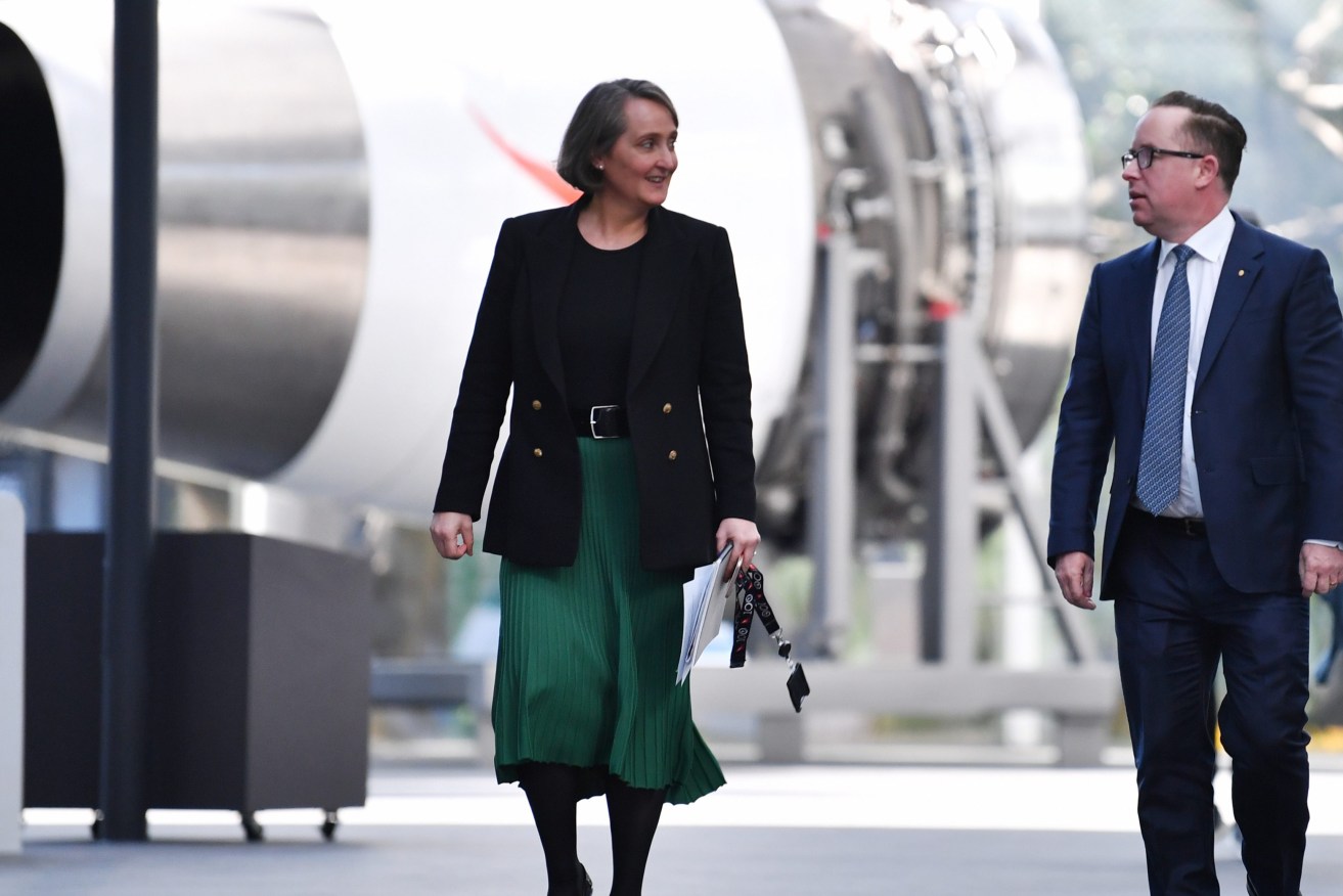 Former Qantas Group Chief Executive Officer Alan Joyce and his replacement Vanessa Hudson walk through QANTAS headquarters following their results announcement  in Sydney. (AAP Image/Dean Lewins) 
