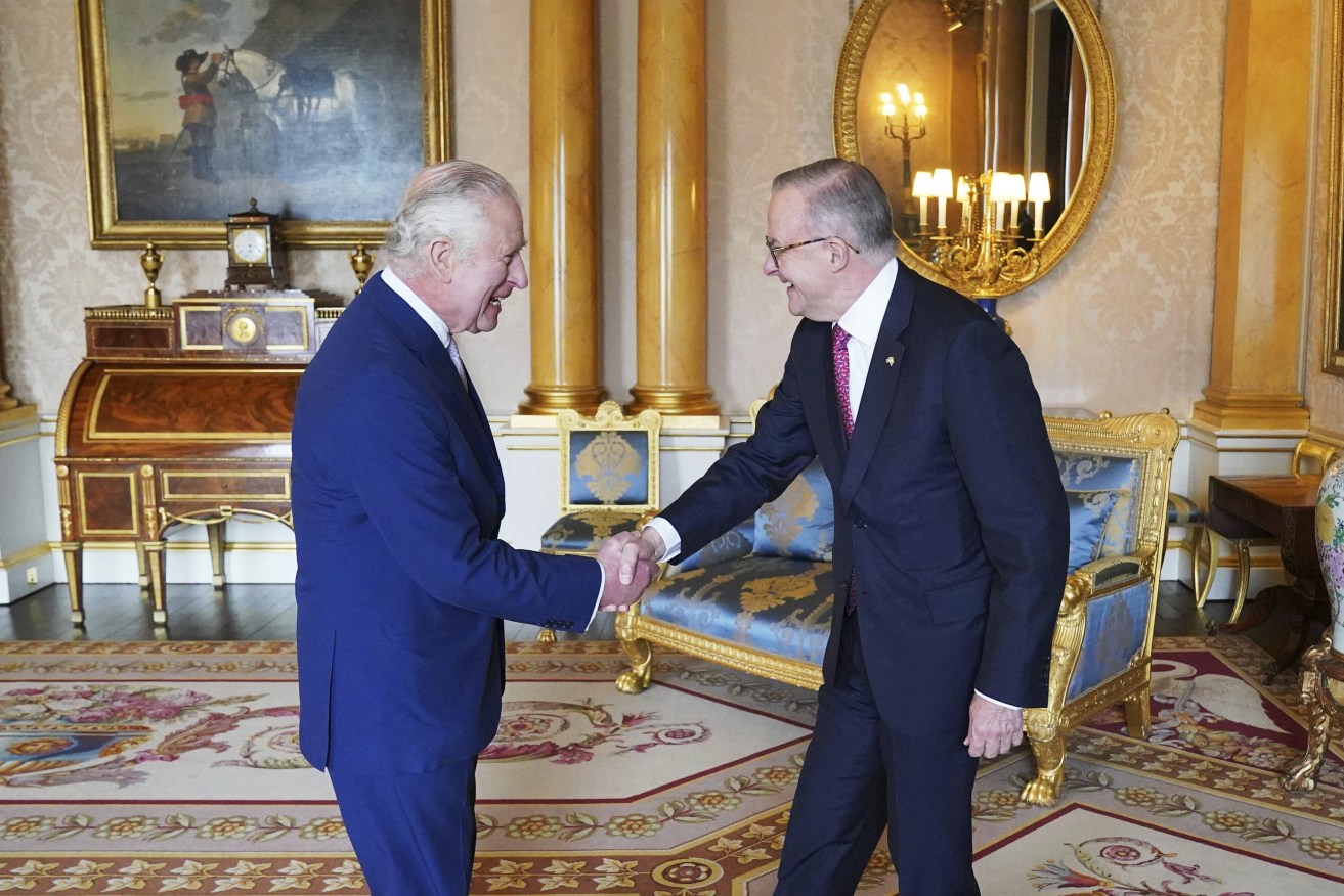 King Charles III, left, receives Australian Prime Minister Anthony Albanese, right, during an audience at Buckingham Palace in London, Britain, Tuesday May 2, 2023. (Jonathan Brady/Pool via AP)