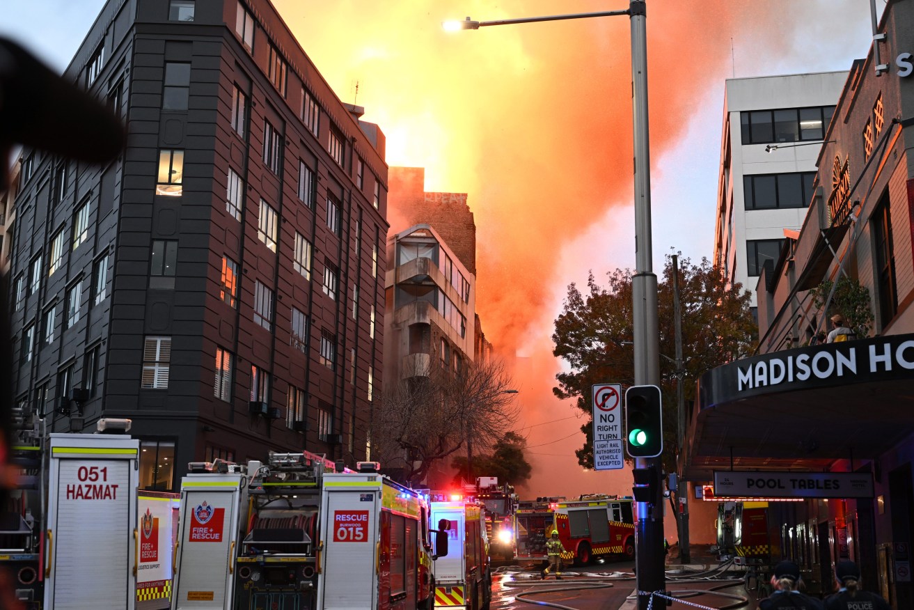 Emergency services at the scene of a building fire in the Central Business District of Sydney. (AAP Image/Dean Lewins) 