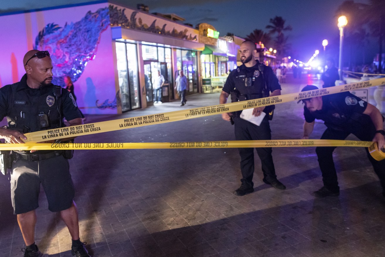 Police officers close off the area where gunfire broke out along a beach boardwalk in Hollywood, Florida. Nine people were transported to area hospitals with gunshot wounds.  EPA/CRISTOBAL HERRERA-ULASHKEVICH