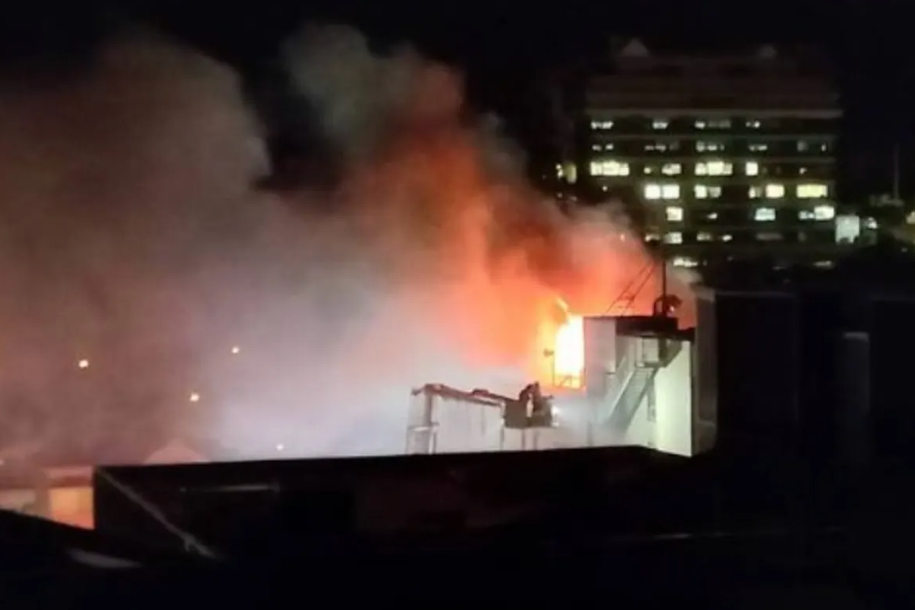 Fire rips through a four-storey backpackers hostel in Wellington, New Zealand. Police fear the death toll may reach double figures. (Image: Stuff.co.nz)