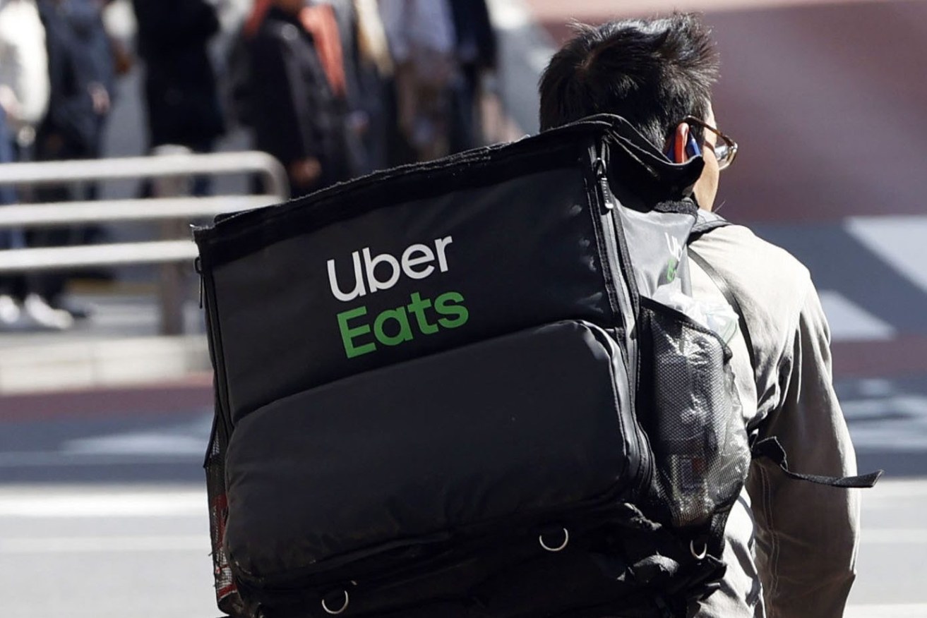 Uber will pay out almost $300m to cabbies whose business were crushed by the arrival of the rideshare player in Australia. (Kyodo via AP Images) ==Kyodo