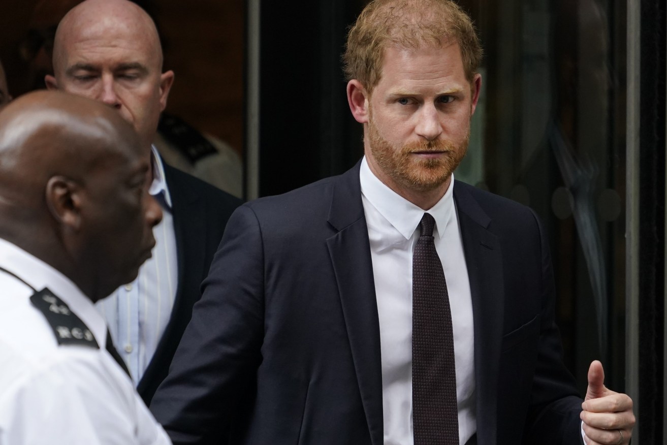 Prince Harry leaves the High Court after giving evidence in London. (AP Photo/Alberto Pezzali)