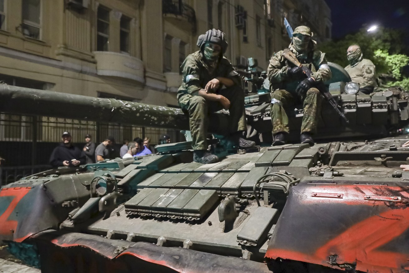 Members of the Wagner Group military company sit atop of a tank on a street in Rostov-on-Don, Russia, prior to leaving an area at the headquarters of the Southern Military District. (AP Photo, File)
