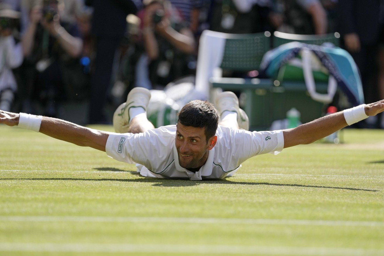 Novak Djokovic celebrates after beating Australia's Nick Kyrgios to win the final of the men's singles at Wimbledon (AP Photo/Alastair Grant, File)