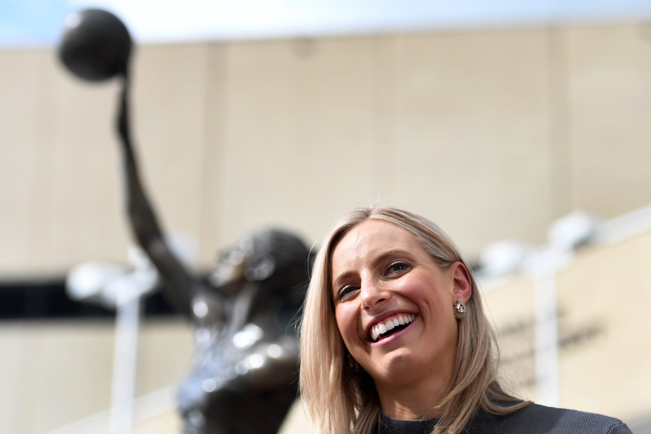 Former Australian and Firebirds Netball captain Laura Geitz smiles during the unveiling of a bronze statue in her image outside the Brisbane Entertainment Centre, Friday, May 12, 2017. (AAP Image/Dan Peled) 