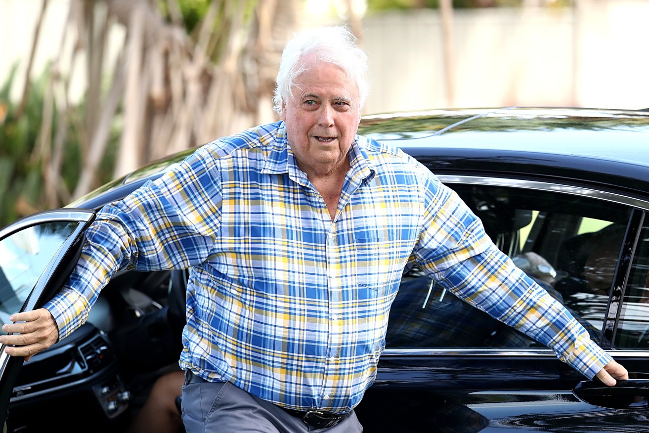 Clive Palmer arrives during an announcement, at Paradise Point on the Gold Coast. (AAP Image/Jason O'Brien) 