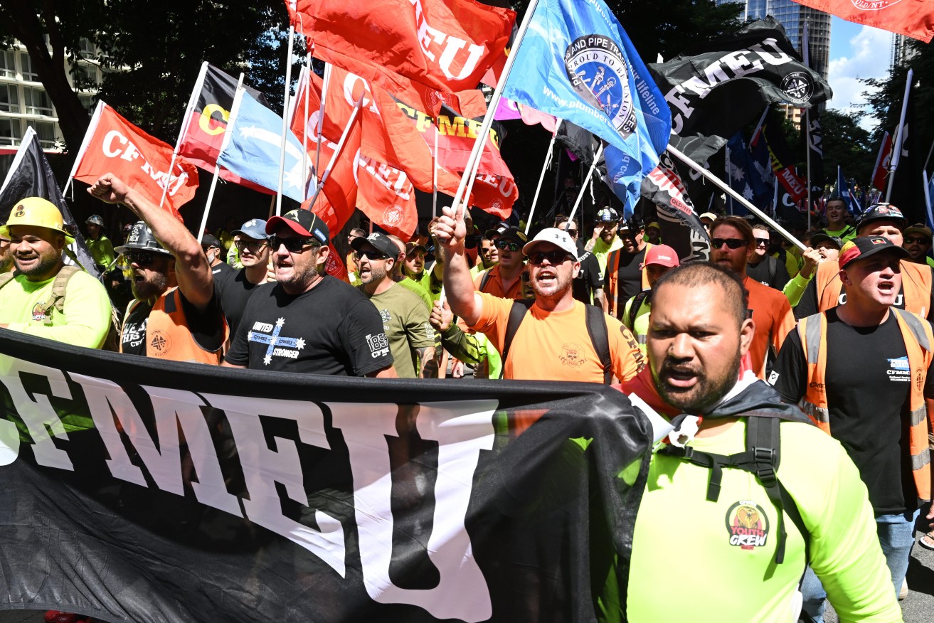 Union members are seen protesting during a CFMEU rally . (AAP Image/Darren England) 