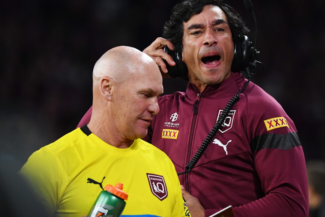 Maroons assistant coach Johnathan Thurston and trainer Allan Langer during State of Origin game 2. Effervescent "Alfie"   might find himself as the team's spokesman during a player media ban.(AAP Image/Jono Searle) 