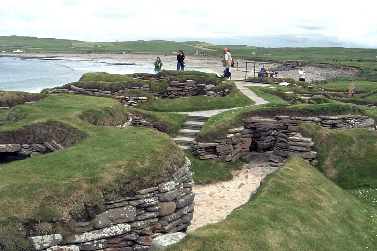 Visitors look at the 5,000 year-old remains of Skara Brae village in the Scottish Orkney Islands. Sick of being ignored by far-away politicians, officials on Scotland’s remote Orkney Islands are mulling a drastic solution. ( AP Photo/Naomi Koppel, File)