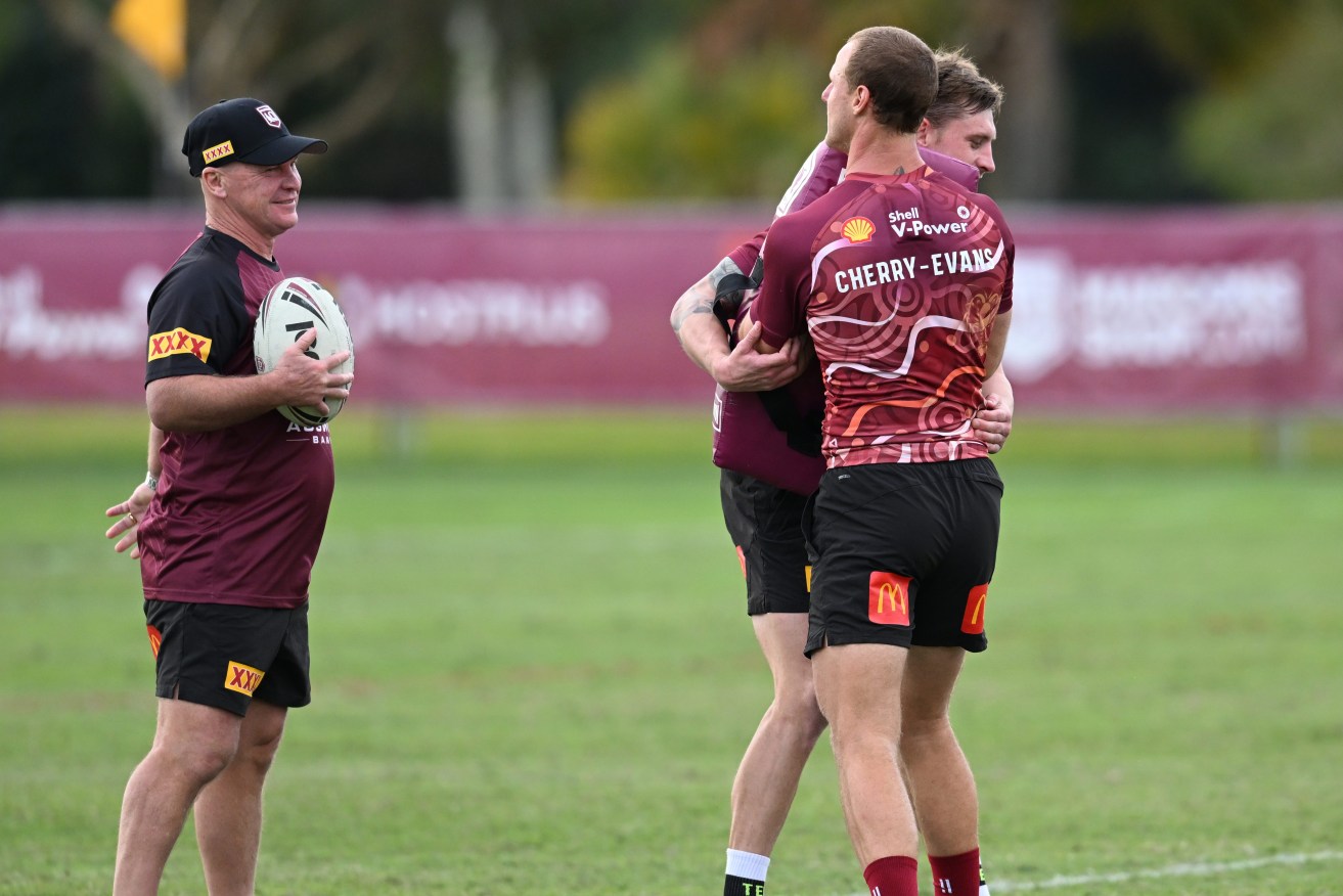 Maroons trainer Allan Langer (left) is seen with Cameron Munster and Daly Cherry-Evans during a Queensland Maroons State of Origin team training session at Sanctuary Cove on the Gold Coast. (AAP Image/Darren England) 