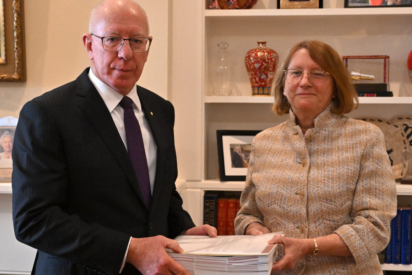 The Commissioner for the Royal Commission into the Robodebt Scheme Catherine Holmes delivers her report to the Governor General David Hurley at Government House in Canberra. (AAP Image/Mick Tsikas)