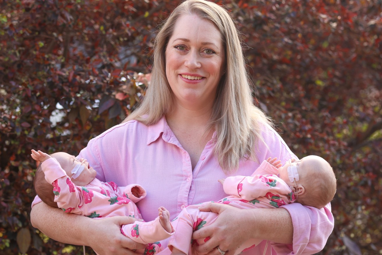 Gold Coast mum Jennifer Hockings with her premature twin girls Audrey and Adeline at Mater Mothers Hospital, Brisbane. Researchers are hopeful the successful trial of a one-shot vaccine will reduce hospitalisation rates for preterm babies (AAP Image/Supplied by Peter Wallis) 