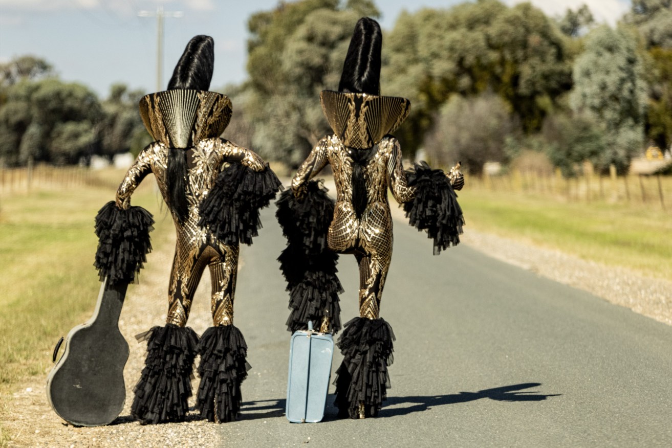 A supplied photograph of 'Suspicious Behinds' by The Huxleys, part of the exhibition DisGraceland which sees two queer alien Elvises go on a road trip in regional Victoria. (AAP Image/Supplied by the Huxleys) 