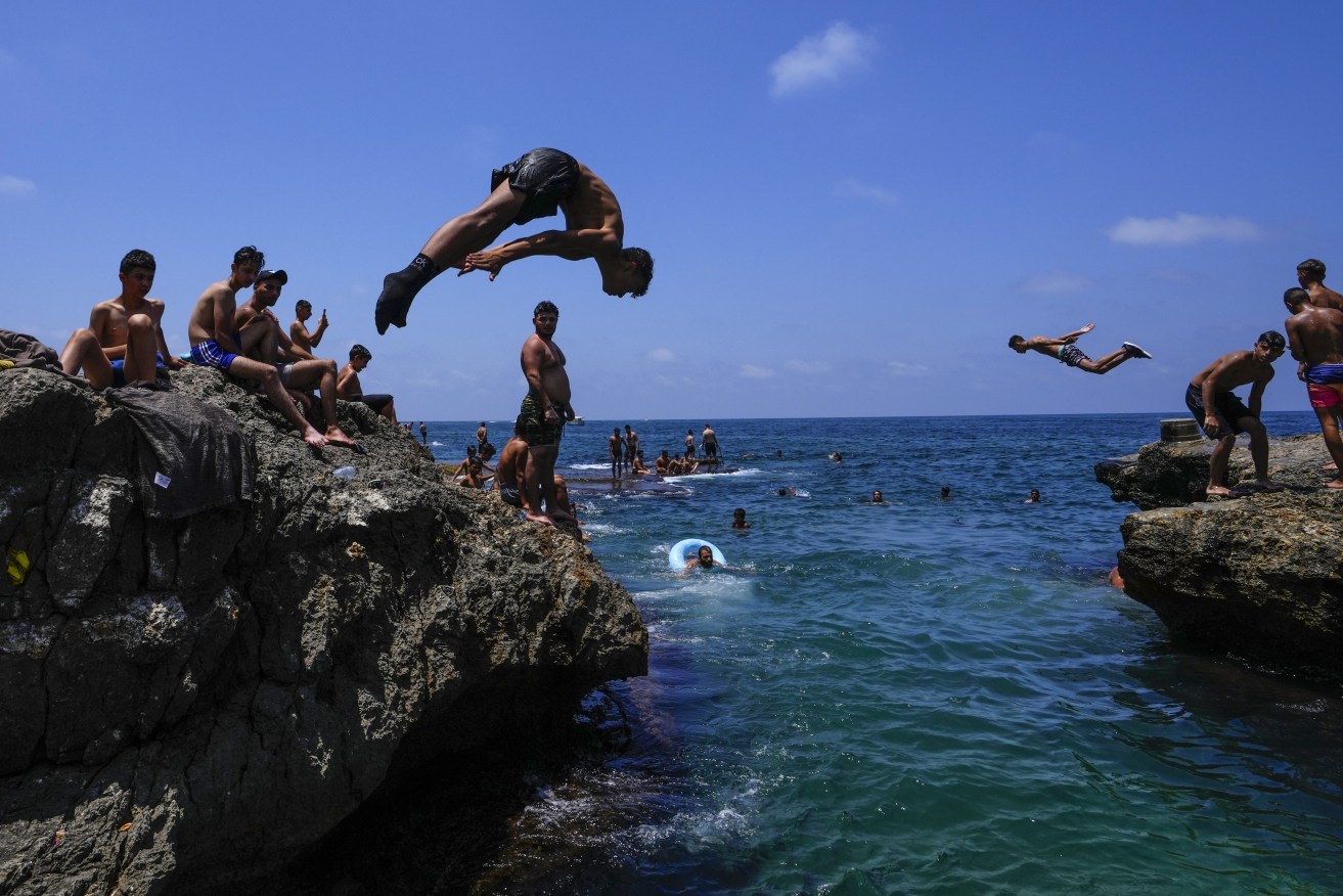 Mediterranean holidays could be losing their allure as costs jump (AP Photo/Hassan Ammar)