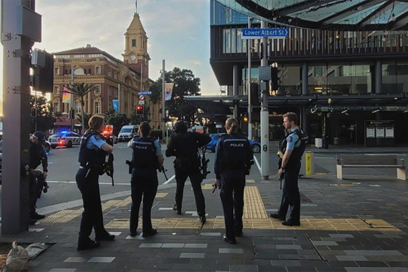  NZ police on the scene in Auckland CBD following reports of gunfire.  It is understood three people, including the gunman have been killed (AAP Image/Supplied) 