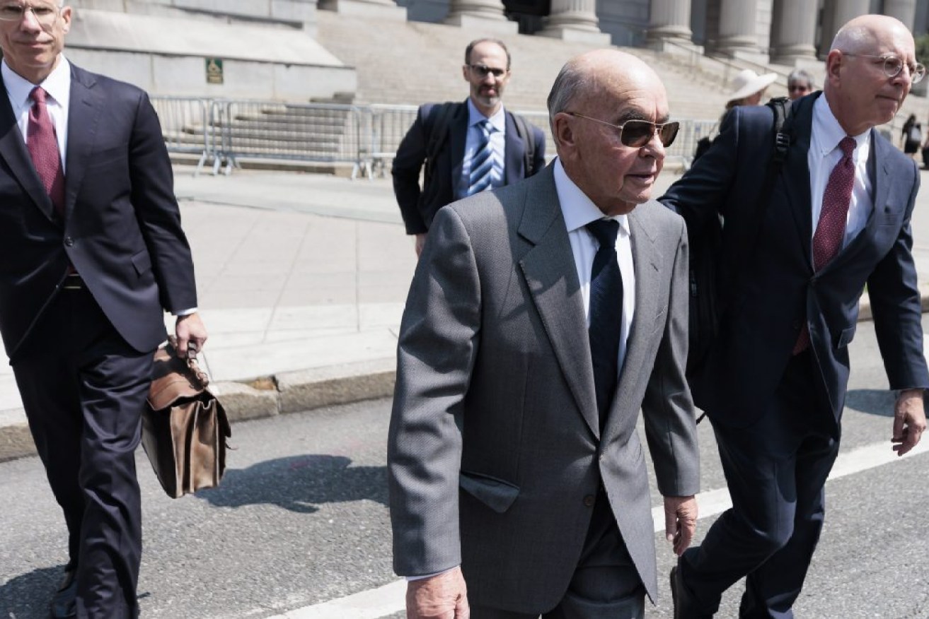  British billionaire and Tottenham Hotspur football team owner Joe Lewis (2-R) walks with his legal team after surrendering to authorities to face an indictment on insider trading charges at United States federal court in New York.  Federal prosecutors are accusing Lewis of providing confidential stock information to friends and associates.  EPA/JUSTIN LANE