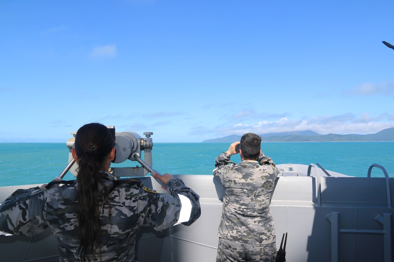 A supplied image obtained Sunday, July 30, 2023. Royal Australian Navy sailors from HMAS Brisbane on the bridge wing scan the horizon during search and rescue operations in the vicinity of Lindeman Island, Queensland, 29 July 2023. A multi-national and multi-agency search and rescue effort is underway following an Australian Army MRH-90 Taipan helicopter impacting waters near Lindeman Island on the night of 28 July 2023 during Exercise Talisman Sabre 23. (AAP Image/Defence Imagery) NO ARCHIVING, EDITORIAL USE ONLY