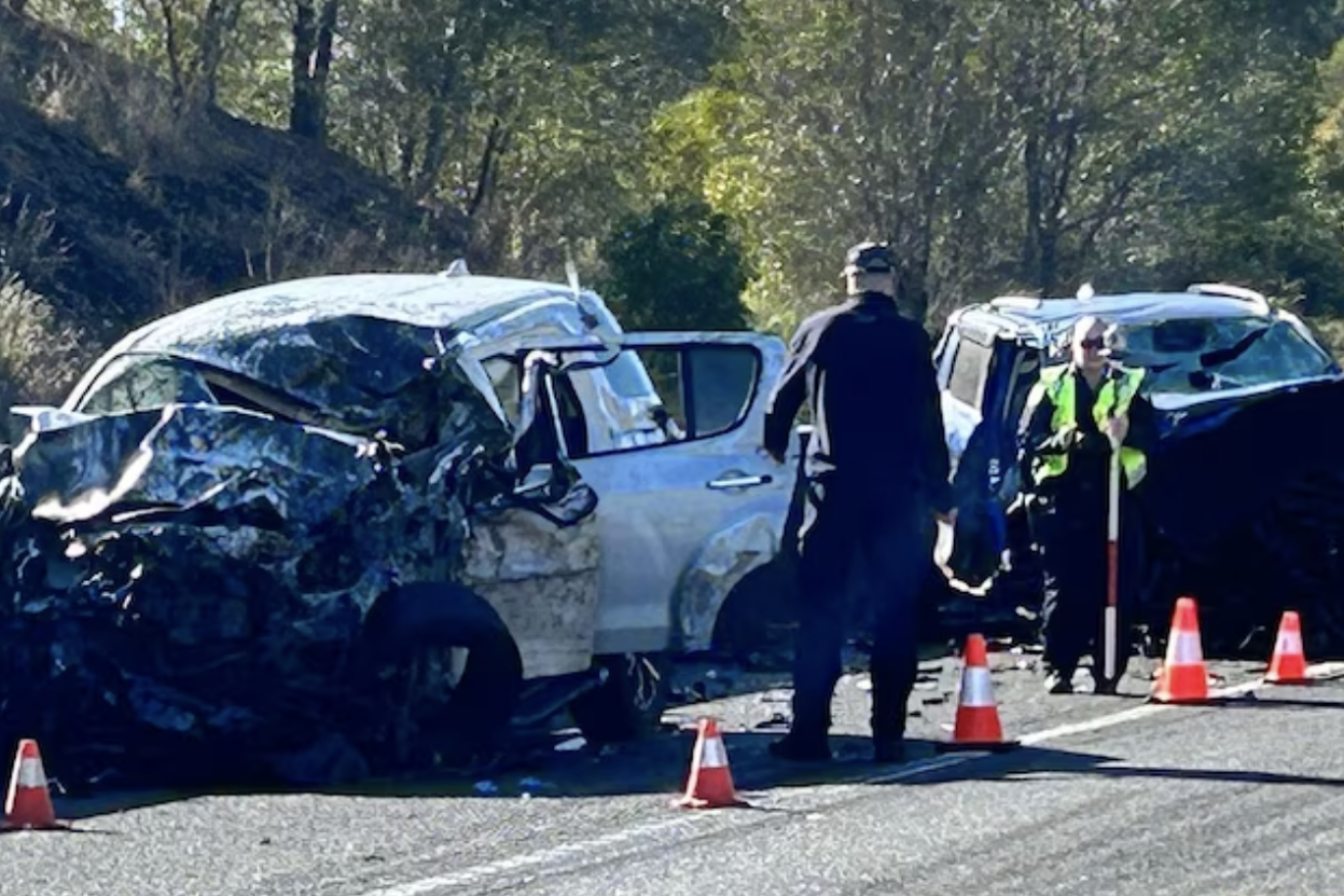 Wreckage is strewn around the Bruce Highway at Federal, scene of a three-car triple fatality smash (Image QPS).