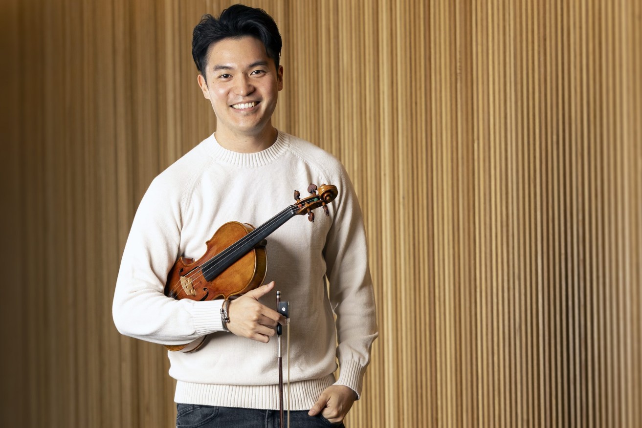 Brisbane's internationally renowned violinist Ray Chen with his priceless 1714 Stradivarius,  (Image; supplied)