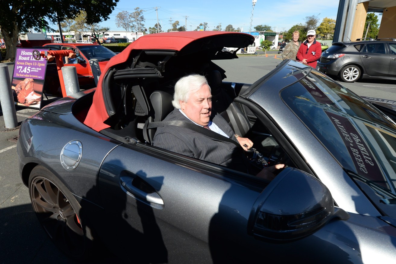 Former politician Clive Palmer would have to pay higher tolls when driving one of his expensive vehicles on the new toll-road model (AAP Image/Lukas Coch) 