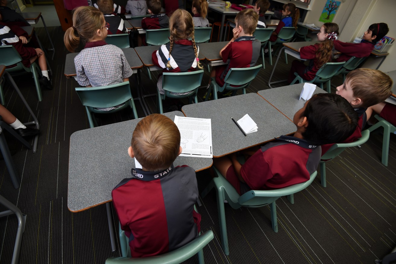 Latest testing shows country students are falling further behind those in city schools. (AAP Image/Dan Peled) 