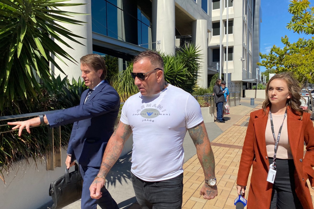 Shane Bowden (centre) is seen outside the Southport Magistrates Court on the Gold Coast. Police allege his eventual killers placed a tracking device while Bowden was in the court house 
 (AAP Image/Robyn Wuth) NO ARCHIVING