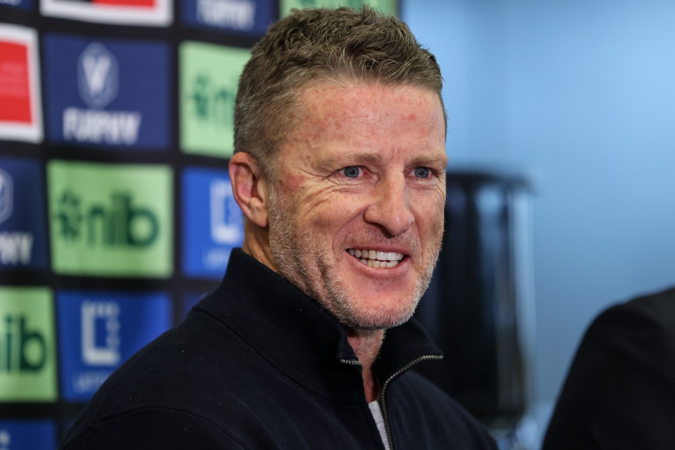 Former Richmond coach Damien Hardwick has signed up for six years as coach of the underperforming Gold Coast 
Suns (AAP Image/Diego Fedele) 