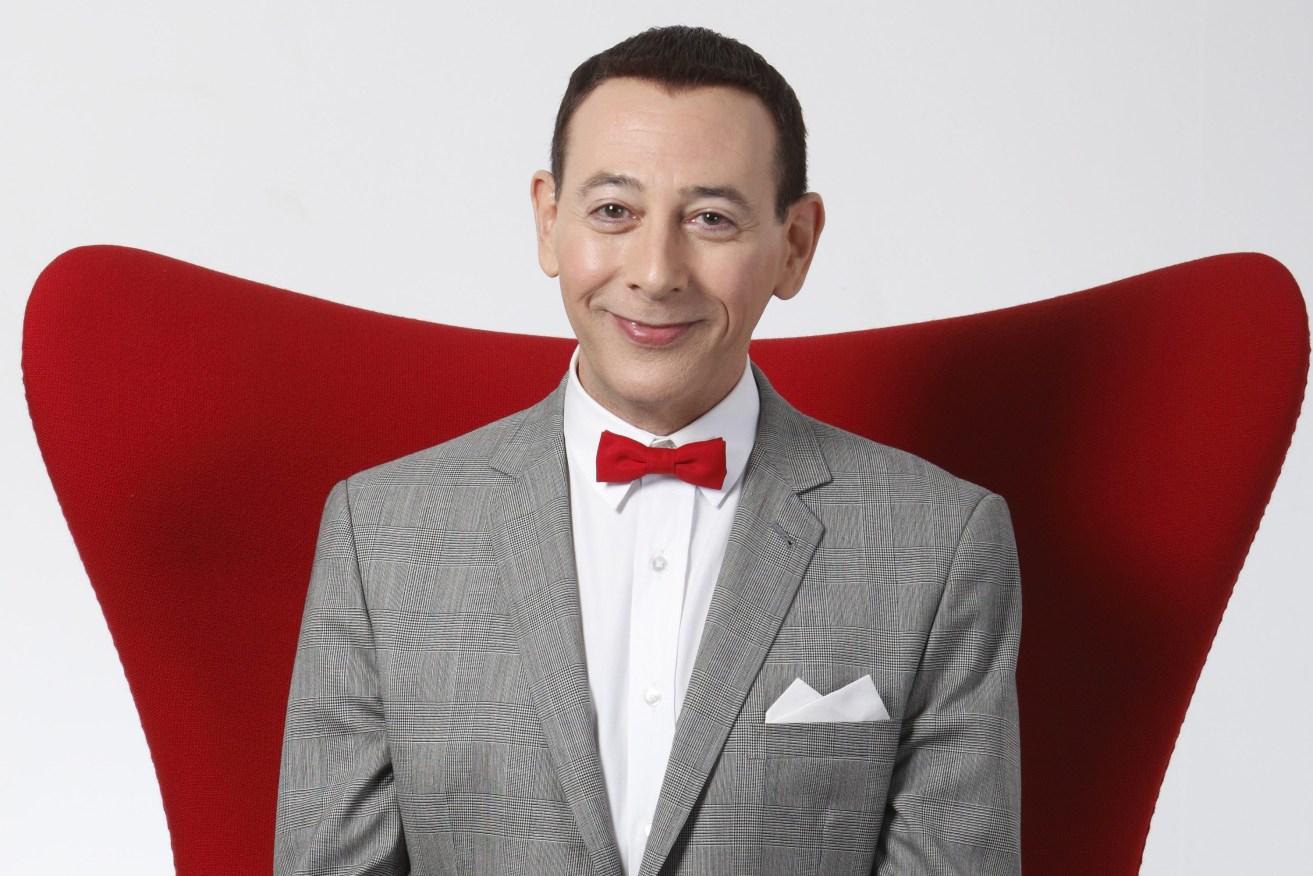Actor Paul Reubens portraying Pee-wee Herman poses for a portrait while promoting "The Pee-wee Herman Show"  in Los Angeles. Reubens died Sunday night after a six-year struggle with cancer that he did not make public, his publicist said in a statement. (AP Photo/Danny Moloshok, File)