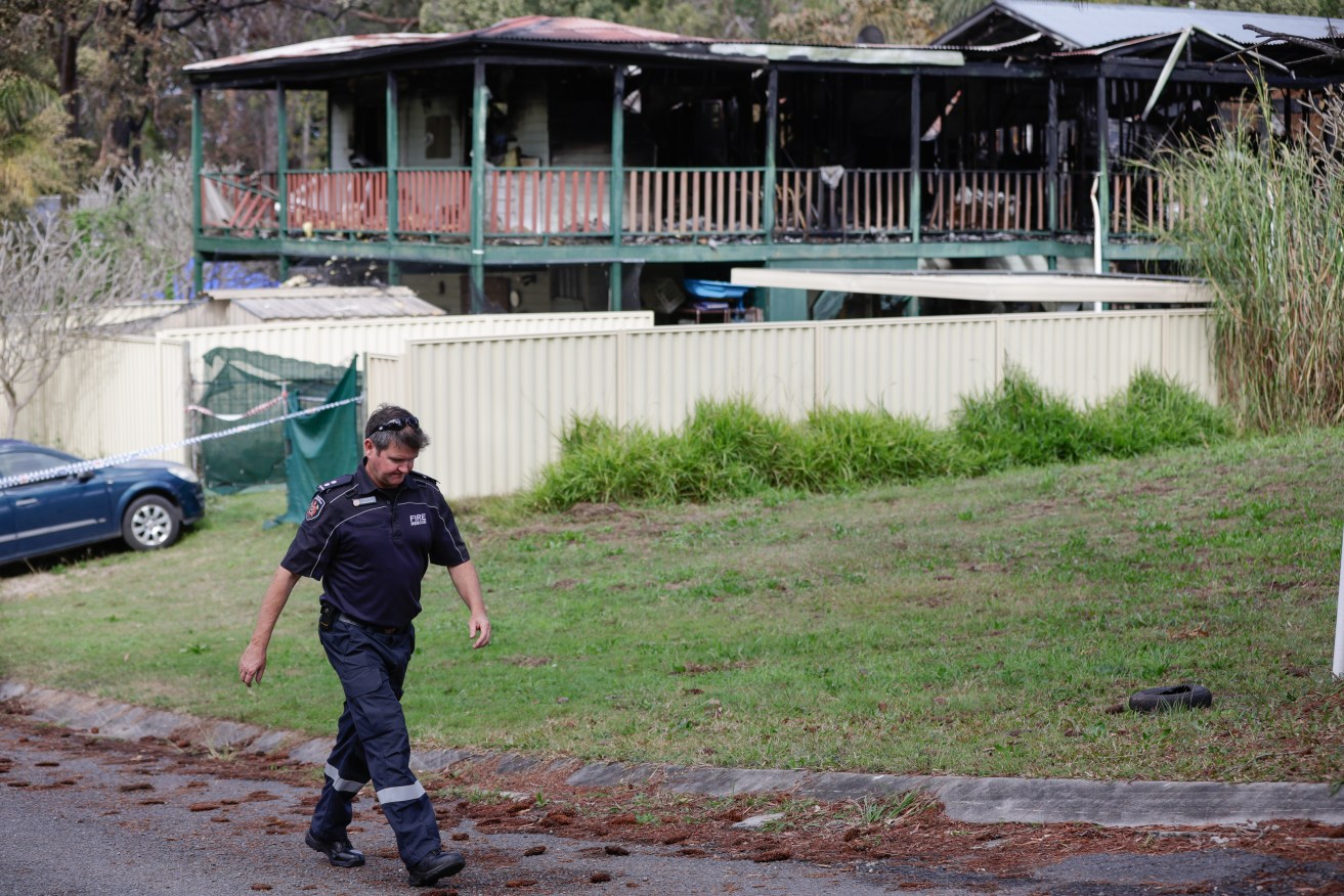 Emergency services at the scene of a house fire at Todman Street on Russell Island, off the coast of Brisbane in Queensland, Monday, August 7, 2023. Fire investigators remain at the scene of a deadly Queensland house fire that claimed the lives of five young boys and their father on an island off Brisbane. (AAP Image/Russell Freeman) NO ARCHIVING