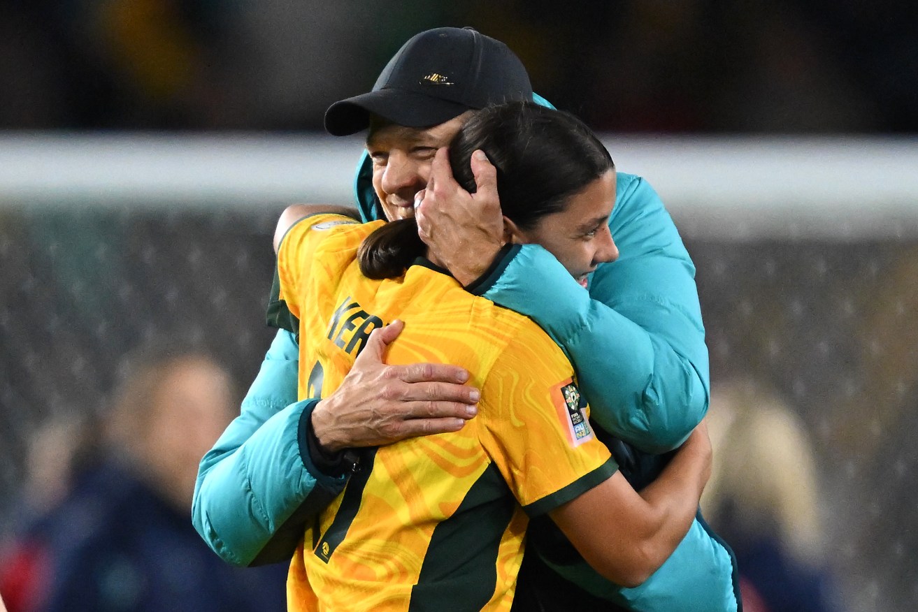 Sam Kerr of Australia embraces Australia head coach Tony Gustavsson after defeating Denmark in the FIFA Women's World Cup 2023 Round of 16 (AAP Image/Dean Lewins) 