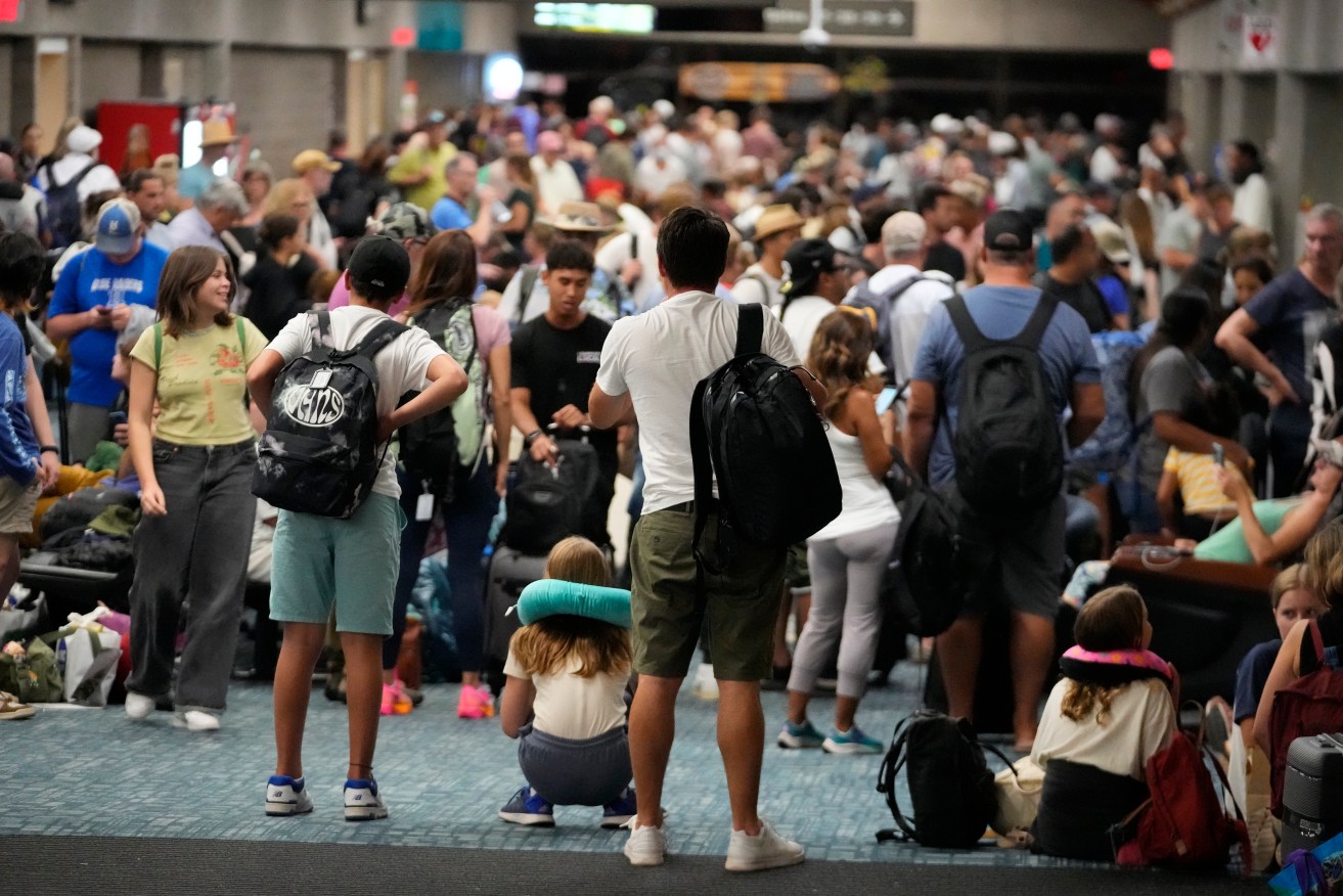 People waiting for flights (AP Photo/Rick Bowmer)