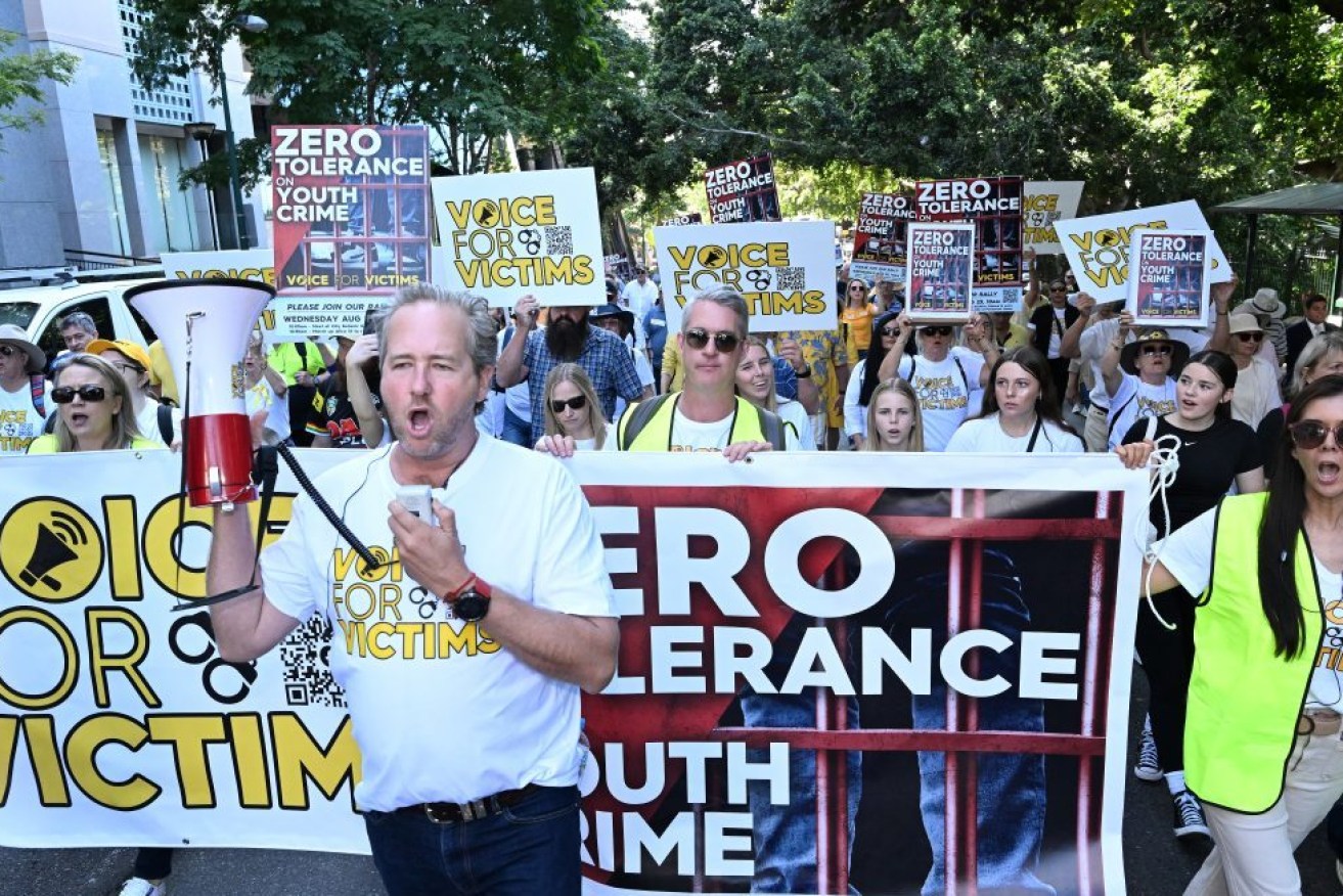 Ben Cannon leads protestors during a Voice for Victims community group rally in Brisbane, Wednesday, August 23, 2023. Victims of crime and their supporters held a rally to protest Queensland’s youth crime rates and the justice system.  (AAP Image/Darren England) NO ARCHIVING