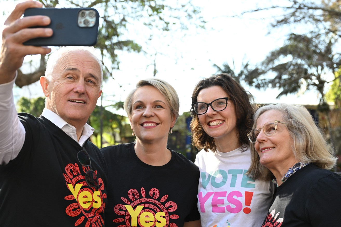 ( Former prime minister Malcolm Turnbull takes a selfie with Federal Minsiter for the Envrioment Tanya Plibersek, Federal member for Wentworth Allegra Spender and Lucy Turnbull ias they hand out Yes campaign material for the Voice in Kings Cross.  (AAP Image/Dean Lewins) 