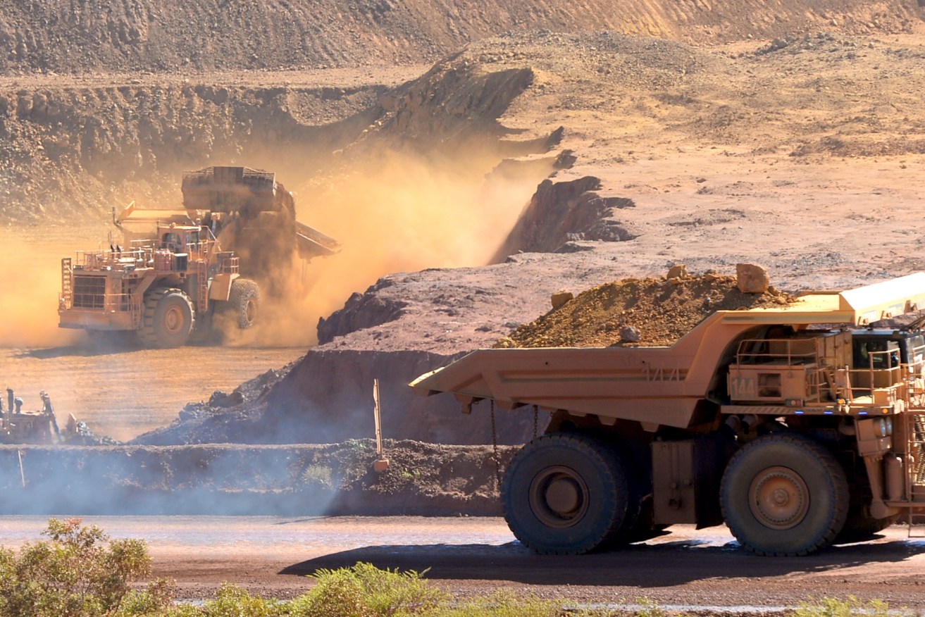Ore excavation at the Rio Tinto West Angelas iron ore mine in the Pilbara region of West Australia Wednesday, July 9, 2014.  (AAP Image/Alan Porritt) 