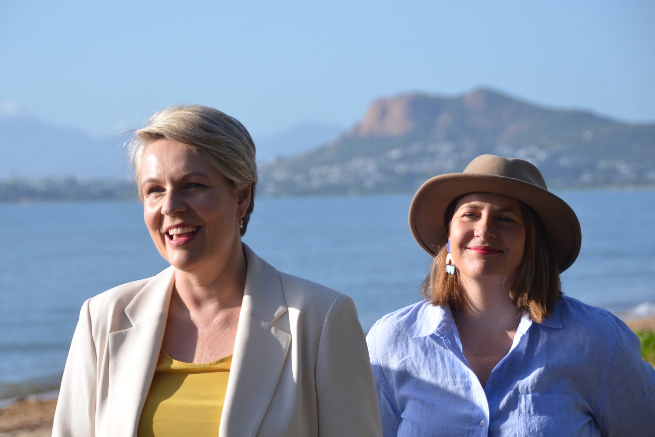 Federal Environment Minister Tanya Plibersek (left) speaks to media with Queensland Labor Senator Nita Green during a press conference at Cape Pallarenda Conservation Park in Townsville, Queensland, Thursday, April 20, 2023. The environment minister has announced a $150 million program to address poor water quality on the reef, one of the key threats identified by UN inspectors. (AAP Image/Fraser Barton) NO ARCHIVING