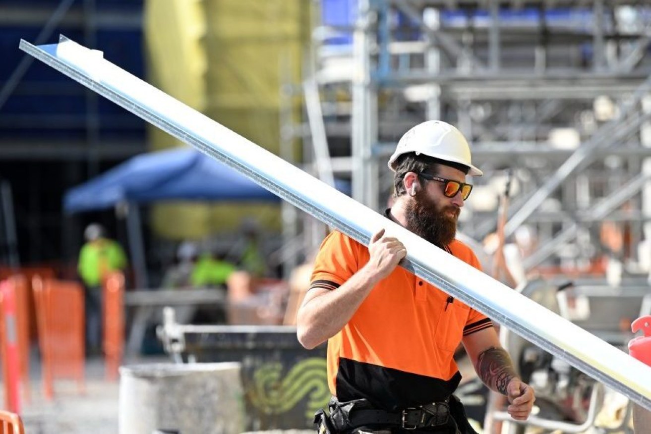 A worker is seen at a new housing building development in Brisbane(AAP Image/Darren England) 