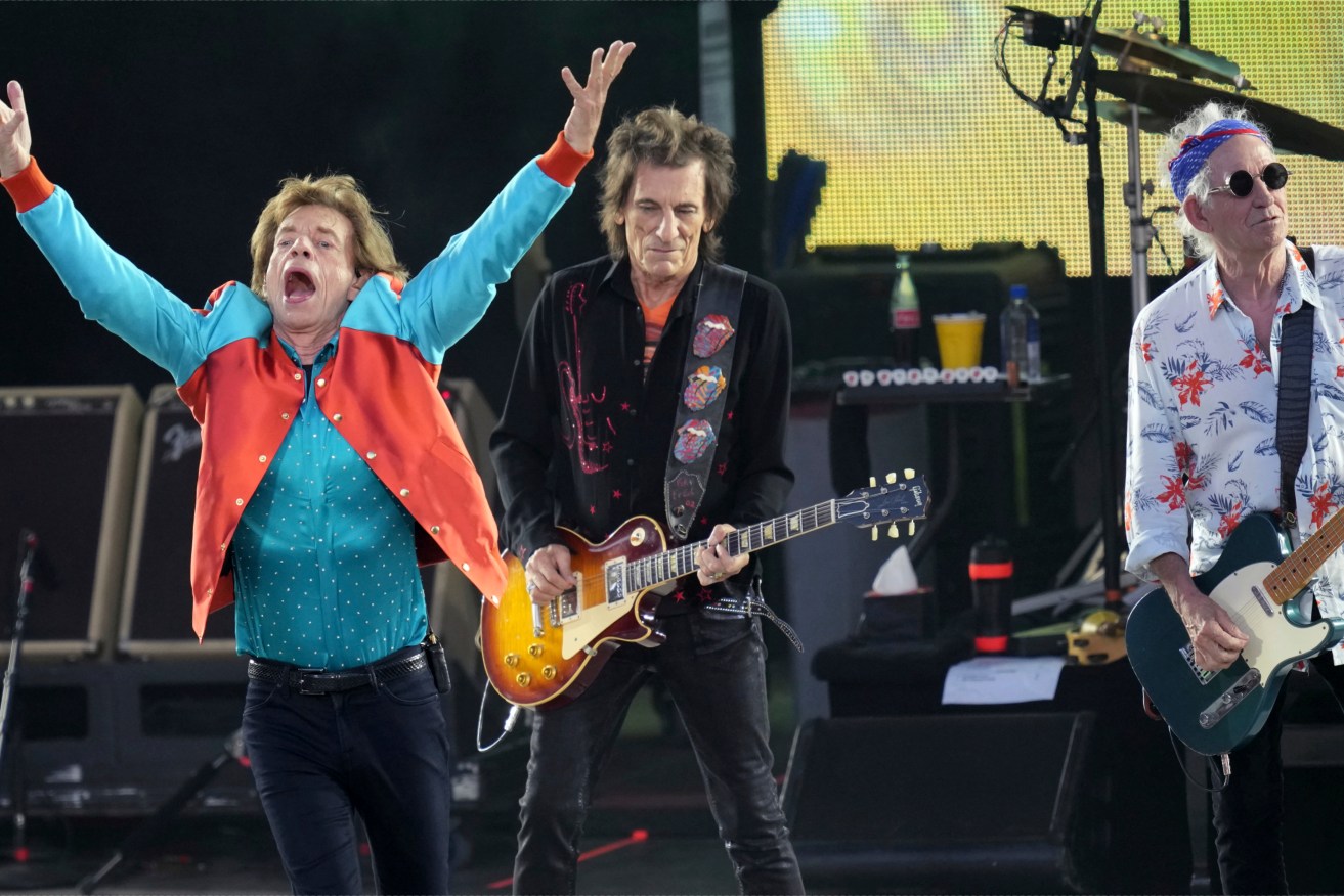 FILE - Mick Jagger, left, Ronnie Wood, center, and Keith Richards, right, of the band "The Rolling Stones," perform onstage during the last concert of their "Sixty" European tour in Berlin, Germany, Aug. 3, 2022. On Monday, Sept. 4, 2023, the Rolling Stones announced they will release their first album of original material in 18 years. Titled “Hackney Diamonds,” the legendary rock band will reveal the full details on Wednesday, Sept. 6, at an event in Hackney in East London. (AP Photo/Michael Sohn, File)