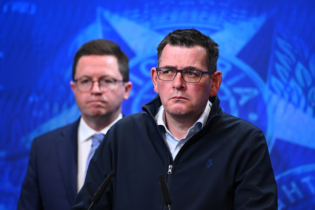 Victorian Minister for Police Anthony Carbines (left) and Victorian Premier Daniel Andrews speak during a press conference in Melbourne. (AAP Image/Joel Carrett)
