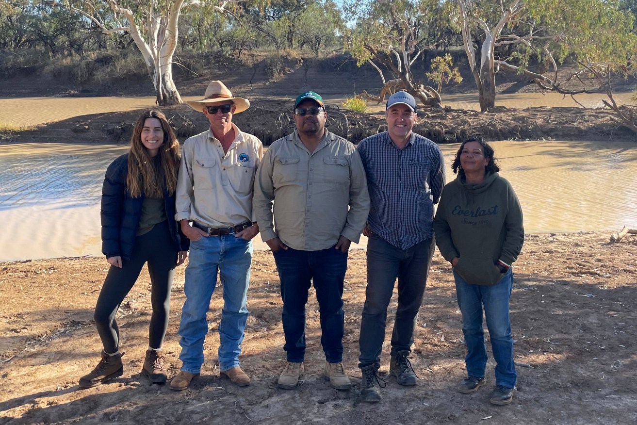 A supplied image obtained on Thursday, September 14, 2023, of those involved in the sale of the station pose for a photo at Thargomindah Station Left to right: Casey Taylor – Conscious Investment Management; Adam Klein – former owner of Thargomindah Station Ronald Saltner – Kullilli Bulloo River Aboriginal Corporation; Glenn Kvassay – Climate Friendly Cassandra Stevens – Kullilli Bulloo River Aboriginal Corporation, at Thargomindah Station, south western QLD. (AAP Image/Supplied) NO ARCHIVING, EDITORIAL USE ONLY