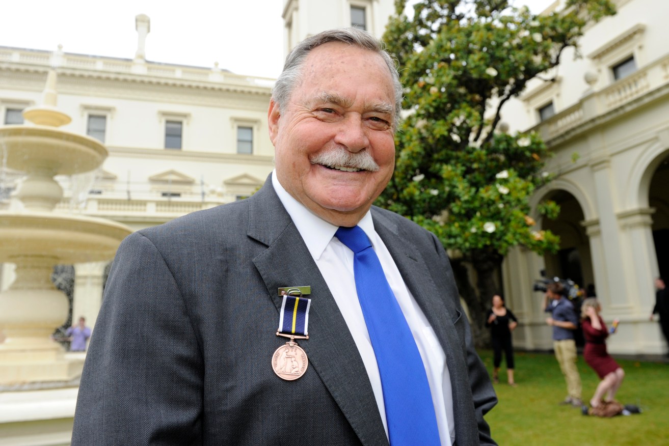 Australian Rules football legend Ron Barassi poses for a photo at Government House in Melbourne. He was the first player to be inaugurated into the Australian Football Hall of Fame as a Legend. (AAP Image/Julian Smith) 