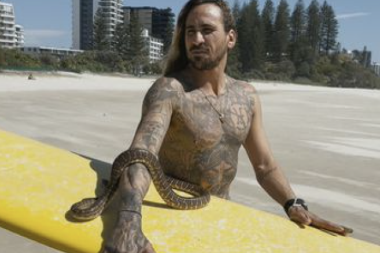 A man's pet snake has cost him more than $2000 for taking it for a surf with him. (Image, channel 9_