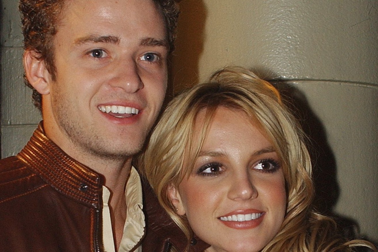 Justin Timberlake of N'SYNC and Britney Spears pose for photographers at the album release party for Britney's new album "Britney," Tuesday, Nov. 6, 2001, in New York. (AP Photo/Louis Lanzano)