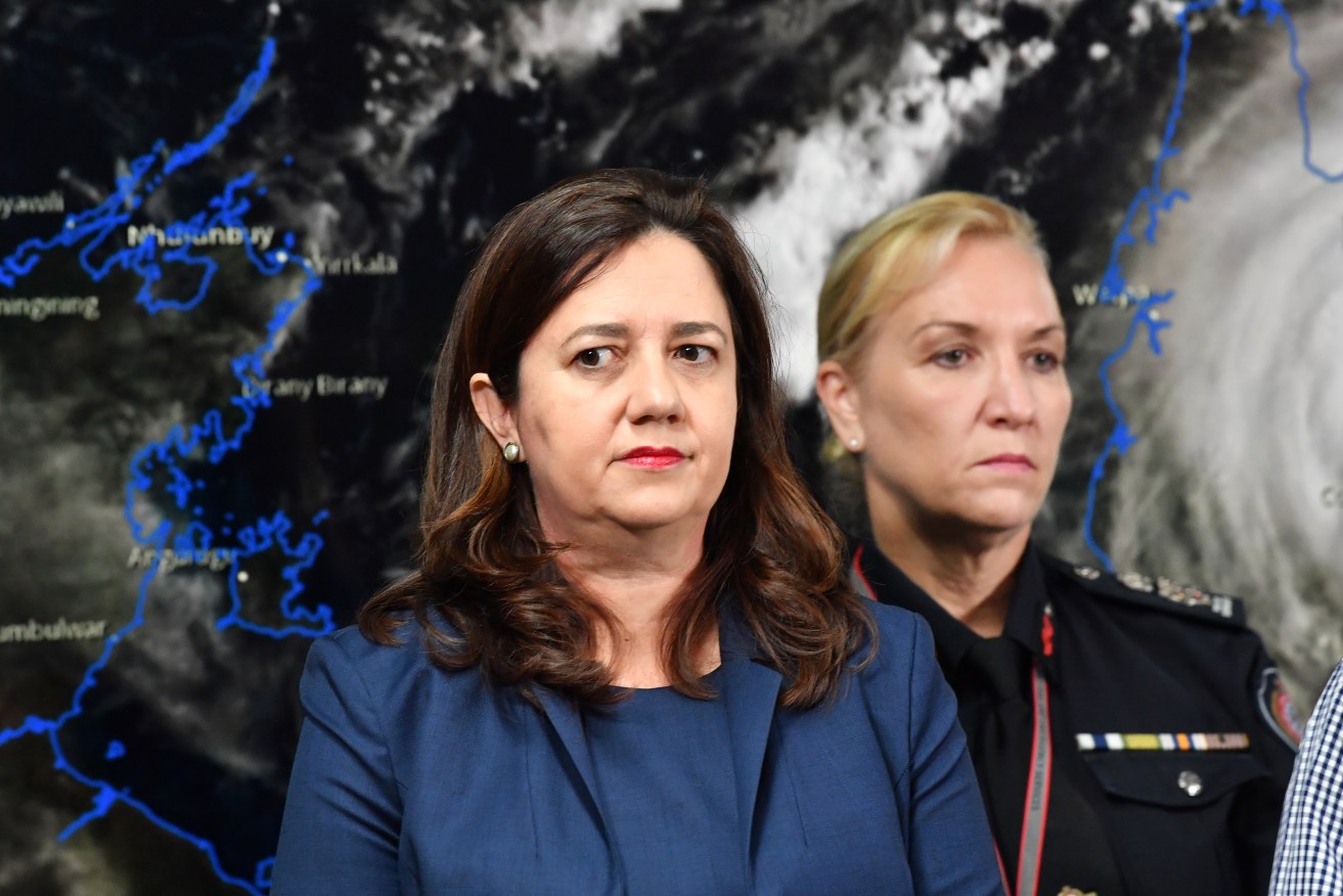 Former Queensland Premier Annastacia Palaszczuk (left) and then-Queensland Fire and Emergency Services Commissioner, Katarina Carroll (right) are seen during a press conference after the meeting of the Queensland Disaster Management Committee at the Emergency Services Complex in Brisbane.  (AAP Image/Darren England) 