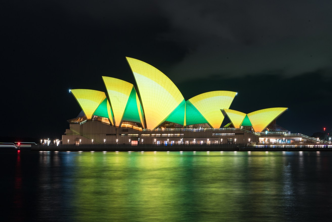 The Sydney Opera House is illuminated ahead of the FIFA Women's World Cup 2023 soccer match between Australia and Denmark, in Sydney, Monday, August 7, 2023. (AAP Image/Flavio Brancaleone) 