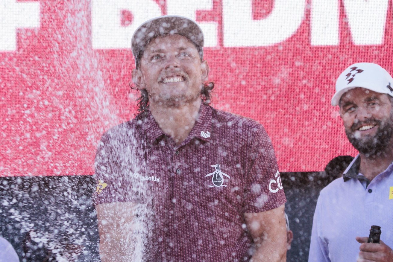 Golfers Cameron Smith (C) and Marc Leishman, all of Australia, spray  champagne to celebrate their team, Ripper GC, winning at the LIV Golf tournament at Trump National Golf Club.  EPA/JUSTIN LANE