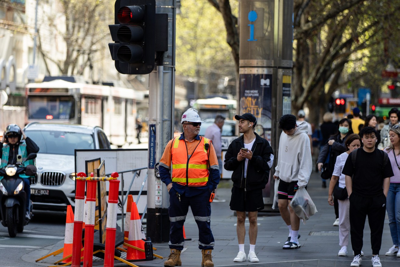 Construction workers are seen in the Central Business District in Melbourne, Friday, September 15, 2023. (AAP Image/Diego Fedele) NO ARCHIVING